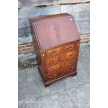 A mahogany and banded fall front bureau, fitted four long drawers, 22 1/2" wide x 16" deep x 38 1/2"