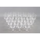 A set of twelve red wine glasses, a matching set of twelve white wine glasses, a quantity of cut and