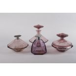 A 1920s amethyst glass oversize dressing table set, comprising powder bowl and cover (small