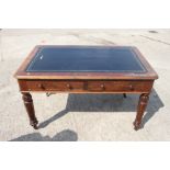 A 19th century walnut library table with tooled lined top, fitted two drawers, on turned and