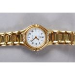 A lady's Artejoia yellow metal bracelet watch with white enamel dial, diamond mounted bezel and