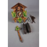 A wooden cased cuckoo clock, 8 1/2" high
