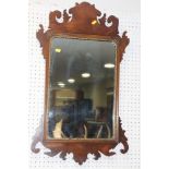 A walnut and gilt framed wall mirror of early 18th century design, plate 18" x 12"