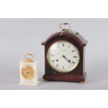 A Comitti of London mahogany cased mantel clock with white enamel dial and Roman numerals, 9 1/2"