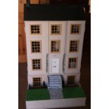 A modern doll's house, "Badgers Hollow", with fitted interior, furniture and figures, 24" wide x 24"