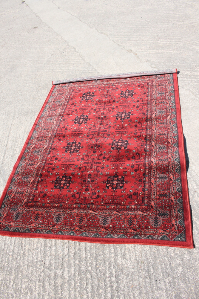 A Royal Kashqai Afghan style pile rug with eight central elephant guls and multi-borders on a