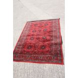A Royal Kashqai Afghan style pile rug with eight central elephant guls and multi-borders on a