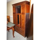 An Edwardian walnut and satinwood banded wardrobe, enclosed mirror door over one long drawer, on