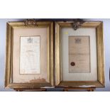 Two early 20th century Royal Warrant certificates, in gilt and brass mounted frames