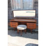 A G Plan "Fresco" teak dressing table, fitted mirror over four drawers and jewel tray, on tapering