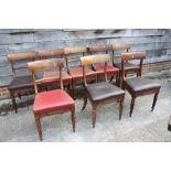 A set of eight early 19th century bar back dining chairs with stuffed over seats, on reeded supports