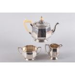 An octagonal silver three-piece teaset, the teapot with ivory handle and knop, 36.6oz troy approx