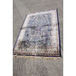 A Kashmir full pile rug with tree of life design on a blue ground, 66" x 47" approx