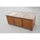 A walnut panelled top linen chest, on bun feet, 48" wide x 22" deep x 21" high