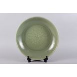 A Chinese celadon glazed charger, 14 1/2" dia