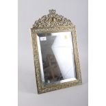 A pierced brass famed easel mirror of restoration design, 19" high