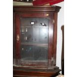 An early 20th century mahogany corner hanging cabinet enclosed glazed panel door, 28 1/2" wide x 14"