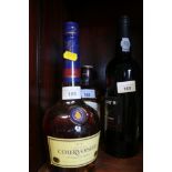 A bottle of Courvoisier brandy, a bottle of "Taylors" Select Reserve, two half bottles of Bells