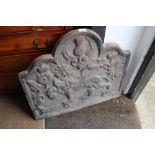 A cast iron fire back with lion rampant and thistle design