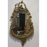 A Rococo style giltwood wall mirror, 32" x 17"