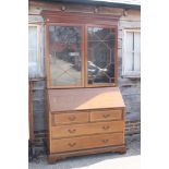 A late 19th century kingwood banded, box and ebony strung bureau bookcase, the upper section