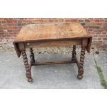 An oak drop leaf table, on barley twist and stretchered supports, 36" wide x 24" deep x 30" high