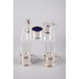 A silver circular four-piece cruet set with blue glass liners and a similar silver mustard pot, 4.
