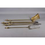 A set of three late 19th century brass fire implements with vase finials and a Beacon patent toaster