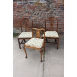 A pair of early 19th century provincial fruitwood side chairs with splint backs and drop-in seats