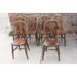 A set of six Windsor wheelback chairs with panel seats