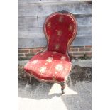 A late 19th century carved mahogany showframe low seat occasional chair, upholstered in a Turkey