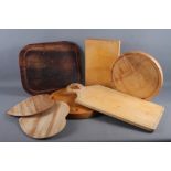 A number of wooden bread/chopping boards of various size and design