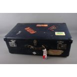 A Globe Trotter suitcase with 1950s-90s labels, 29" x 18" x 10"