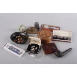 A faux tortoiseshell cigarette case, two travel clocks, military buttons, a large pewter thimble and