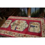 A rug with three rustic scenes in shades of red and natural, 48" x 24" approx