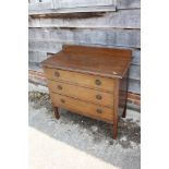 An oak chest of three drawers, on stile supports, 33" wide x 17" deep x 33" high
