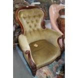 A Victorian mahogany show frame balloon back armchair button upholstered in green velour on turned