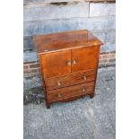 A 19th century bedside cupboard enclosed two doors over two drawers, on bracket feet, 24" wide x 16"