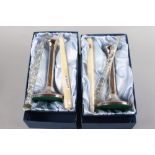 A pair of cylindrical silver candlesticks, in boxes, 8 1/4" high
