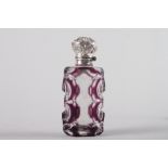 A 19th century amethyst overlaid, cut glass and silver mounted scent bottle, 2 3/4" high