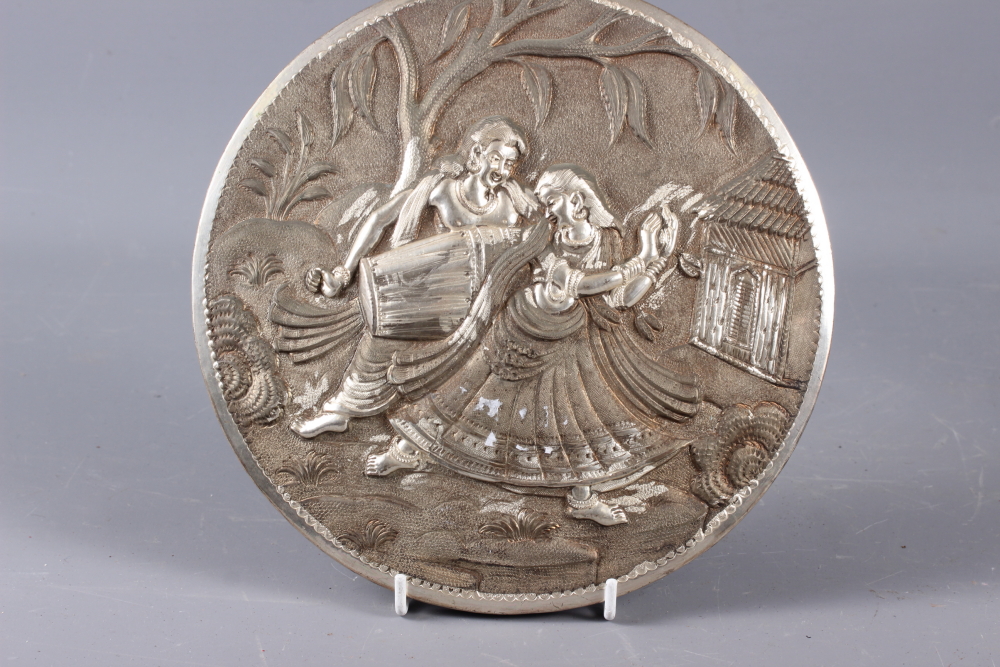 An Indian embossed circular panel with dancer and musician, 8 1/2" dia, a white metal mounted mirror - Image 2 of 6