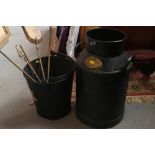 A black metal milk churn, 20 3/4" high, a black metal bucket, and fire irons etc