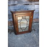 An oak corner hanging cabinet enclosed astragal glazed door, 30" wide x 15" deep x 37 1/2" high