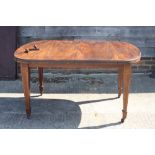 A late 19th century mahogany extending dining table with two extra leaves, on line inlaid square