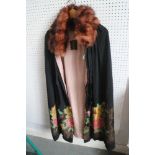A 1920s Liberty & Co silk opera cloak with floral and embroidered decoration and fur collar