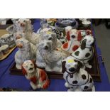 Three pairs of Staffordshire dogs and six other Staffordshire dogs, largest 12 3/4" high (damages)
