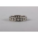 A white metal and diamond full eternity ring, size 0, 4.3g