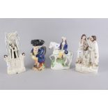 A Staffordshire figure group, "Wesley", 11" high, another figure group, "Tom King", 9 1/4" high,