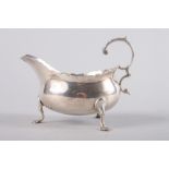 A Georgian silver sauce boat with shaped edge and 'C' scroll handle, 3.2oz troy approx