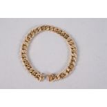 A yellow metal curb link bracelet, set seventy-two brilliant cut diamonds, 7" long, 31.6g